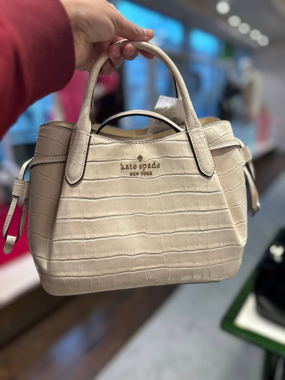 Kate Spade small dumpling croc embossed in bare